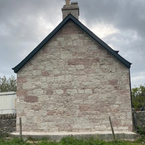 Wall being repointed
