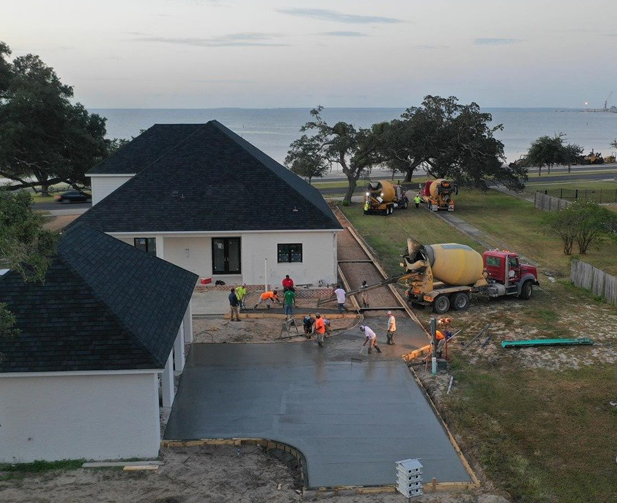 Commercial — Concrete Pouring During Commercial Concreting Floors of Building in Biloxi, MS Commercial — Concrete Pouring During Commercial Concreting Floors of Building in Biloxi, MS