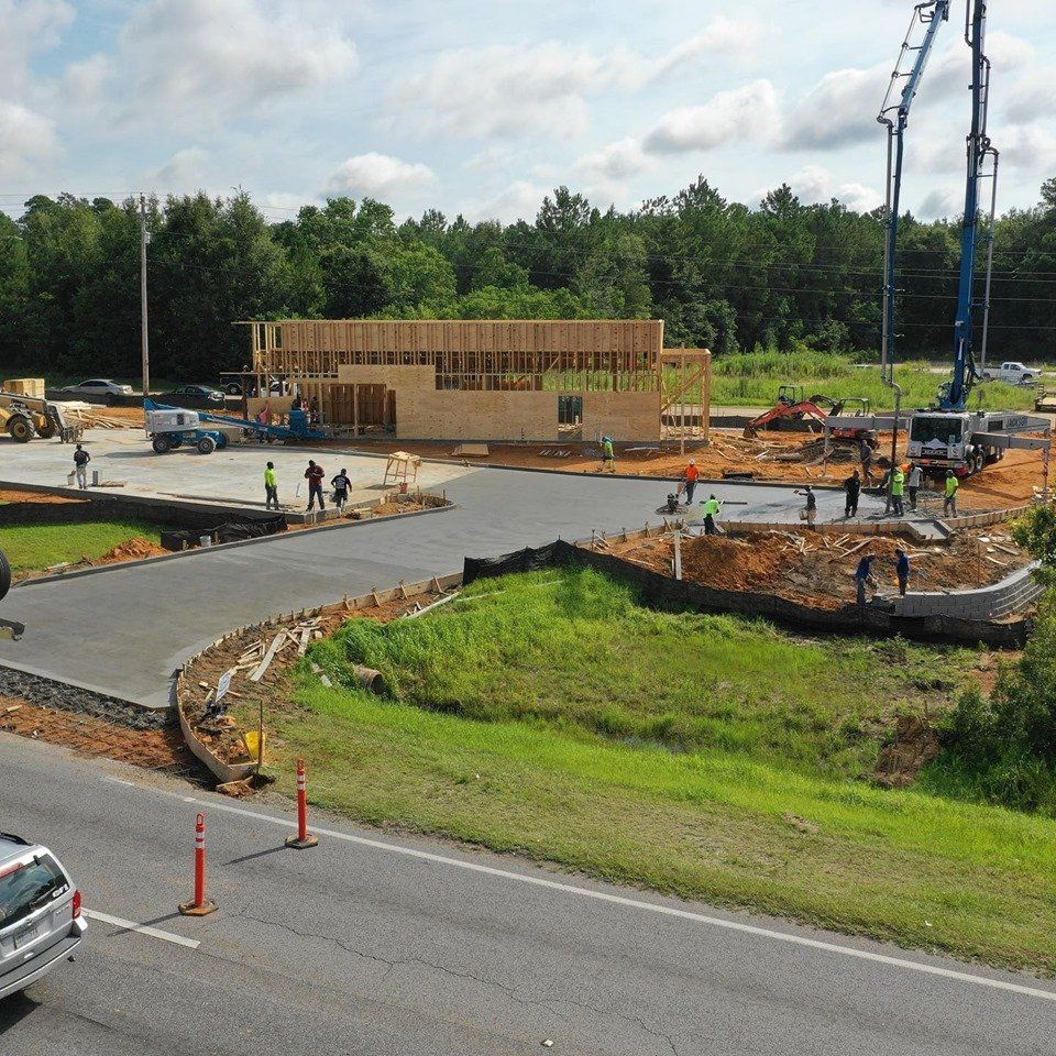 Pouring Concrete with Worker — Biloxi, MS — C. Mason Concrete