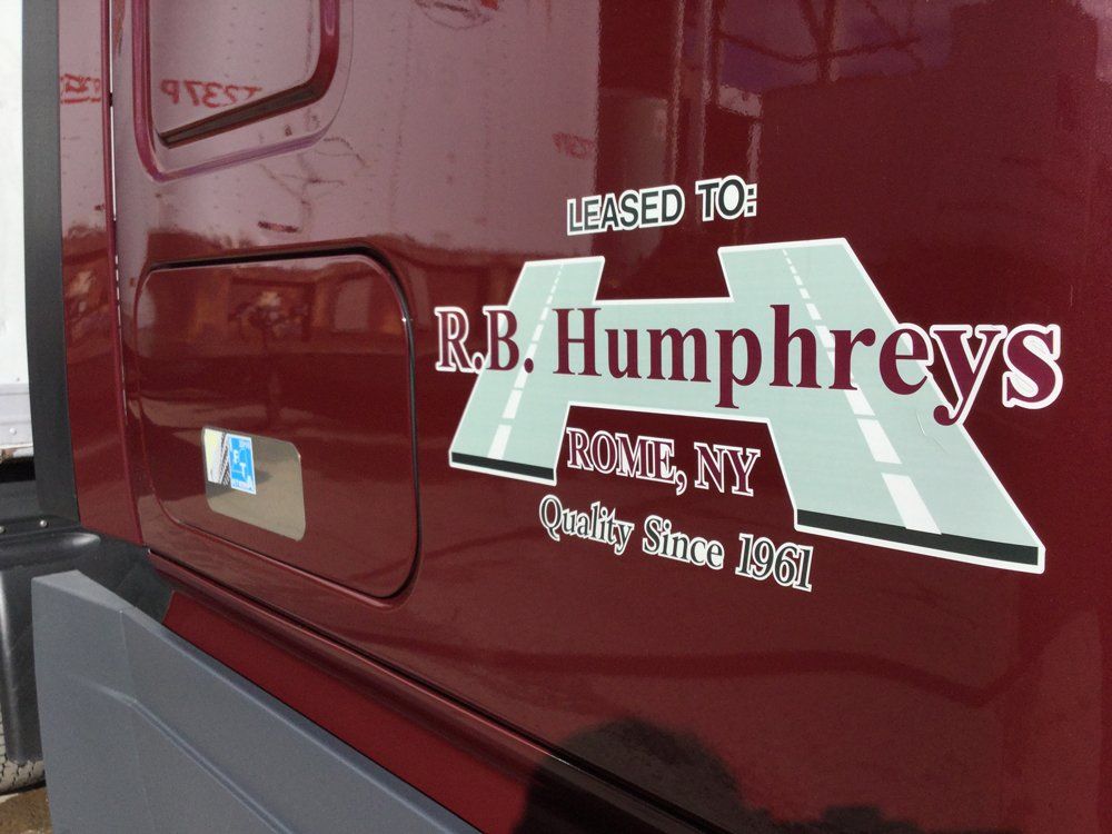 Truck Equipment — Maroon Truck With Company Logo in Rome, NY