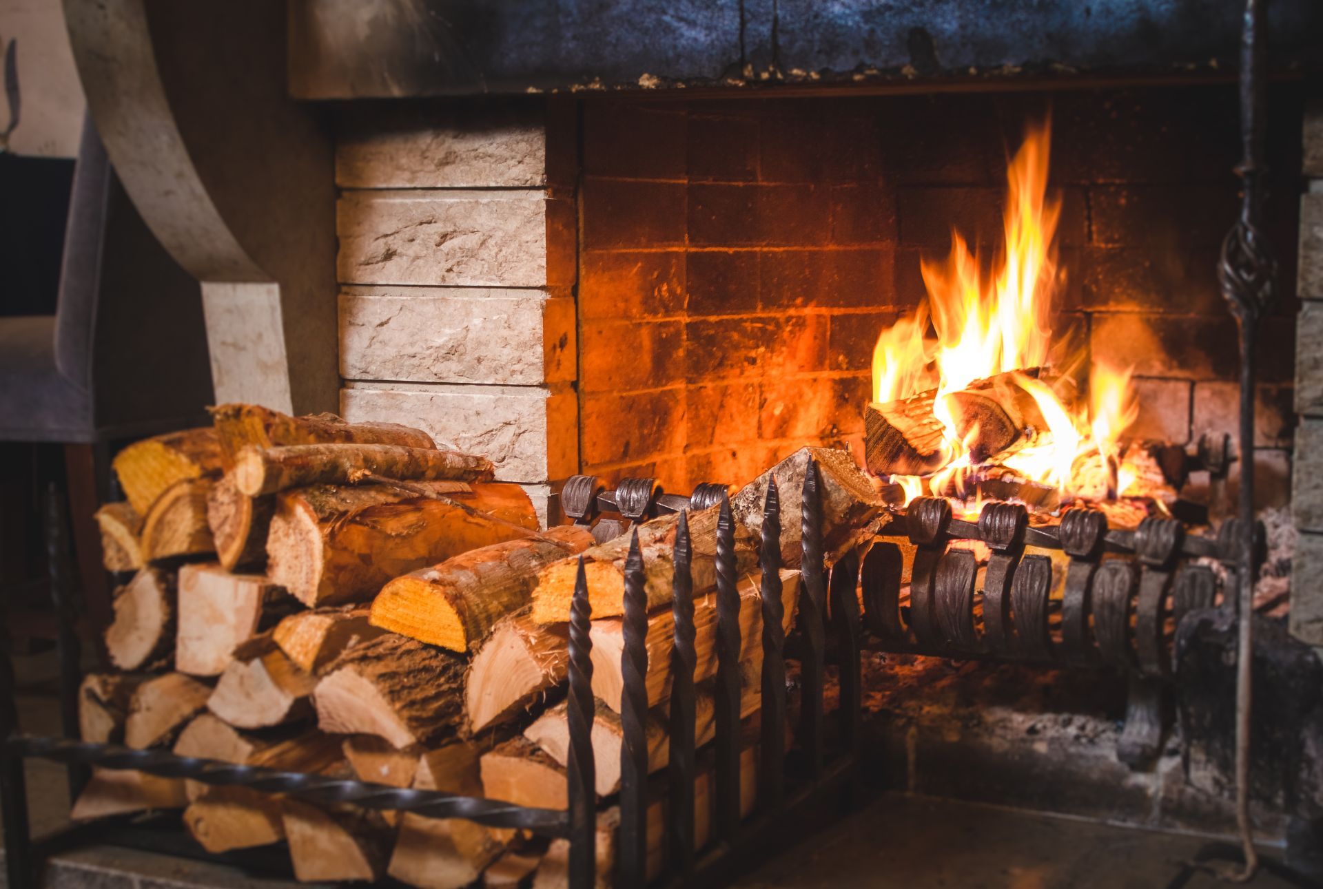 Firewood by a fireplace