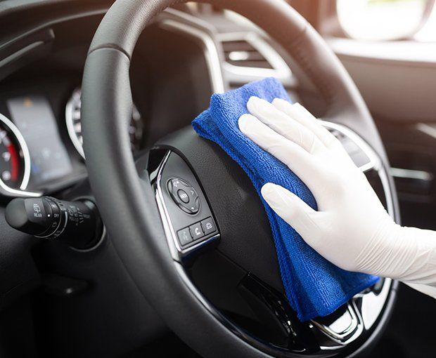 Cleaning Car Steering Wheel — Oklahoma City, OK — Super Clean Full Service Car Wash And Detail Shop