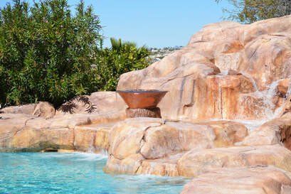 a waterfall built into a pool az