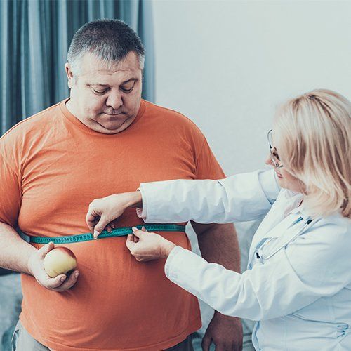 Fat Man with Doctor in White Coat — Hampton, VA — Doctors Weight Loss Clinic Fat Man with Doctor in White Coat — Hampton, VA — Doctors Weight Loss Clinic