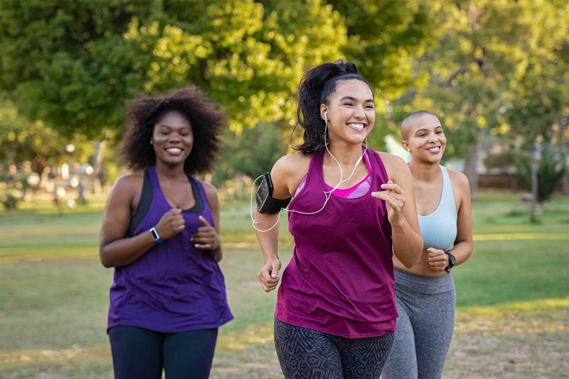 Smiling Young Women Running at The Park — Hampton, VA — Doctors Weight Loss Clinic