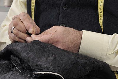 Tailor Mending a Dress
