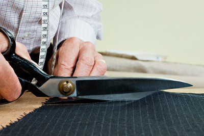 Tailor Cutting Fabric