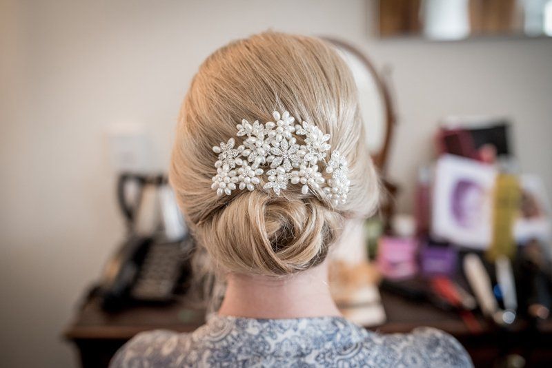 bridal hair updo with crystal hair accessory by Jax-Glam Beauty wedding stylist Bristol