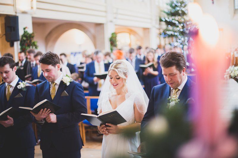 bride walking down aisle with bridal hair and makeup by Jax-Glam Beauty Bristol