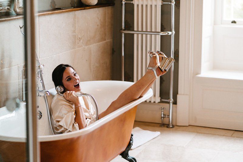 bride relaxing during wedding morning preparation with bridal makeup by Jax-Glam Beauty Bristol