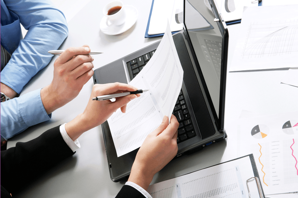 two people looking at paperwork