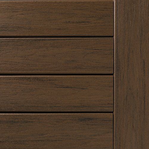 Close-up of brown composite decking planks next to a matching vertical board.
