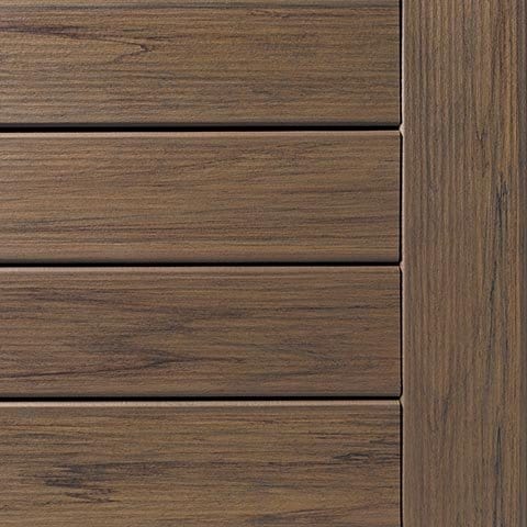 Brown composite deck boards with a matching border, showing wood grain.