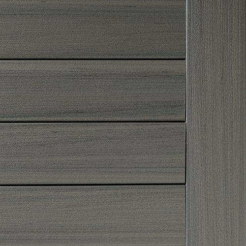 Gray composite decking with a vertical, brushed metal accent.