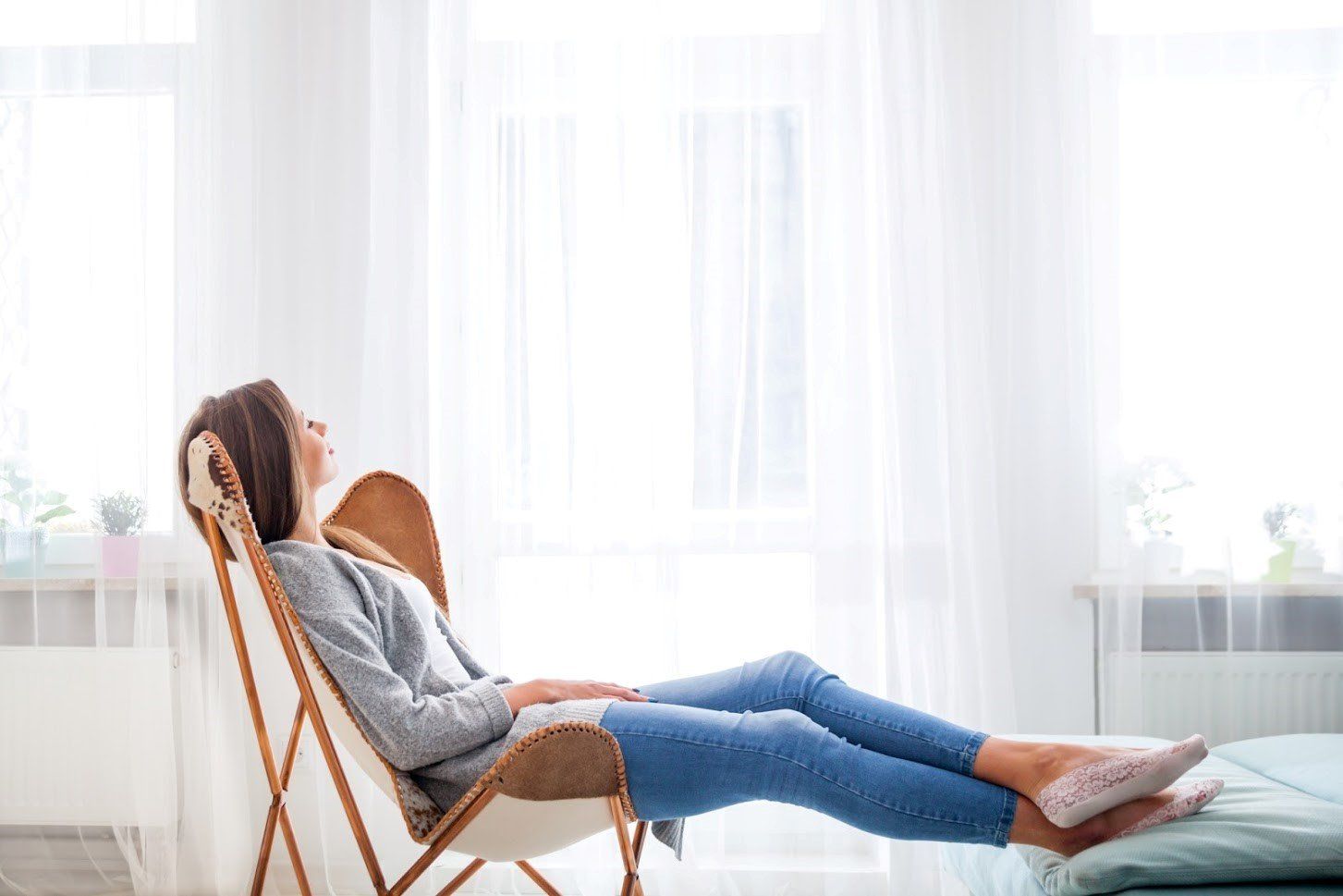 Girl Sitting on a Chair — Fort Myers, FL — Weather Control Air Conditioning, Inc. Girl Sitting on a Chair — Fort Myers, FL — Weather Control Air Conditioning, Inc.