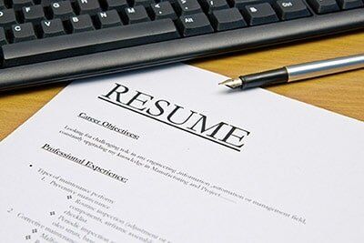Top Staffing Agency — Resume and Pen on Table in Garland, TX