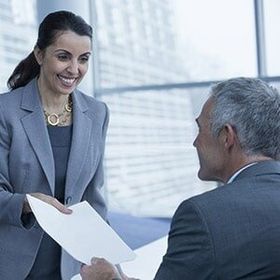 Job Placement Services — Smiling Person Handing Paper in Garland, TX