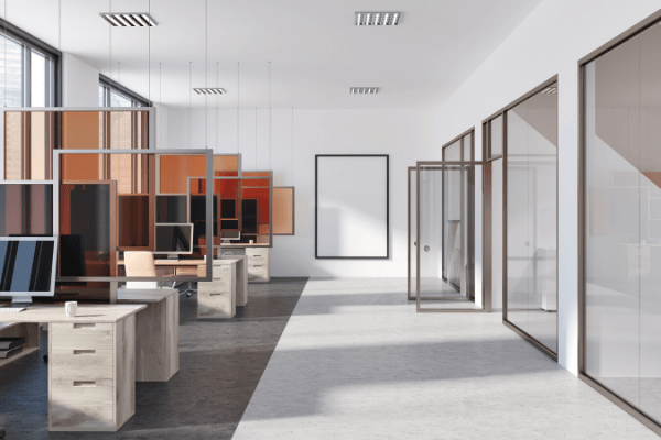 A row of cleaned desks and offices with glass walls and glass doors for commercial janitorial services