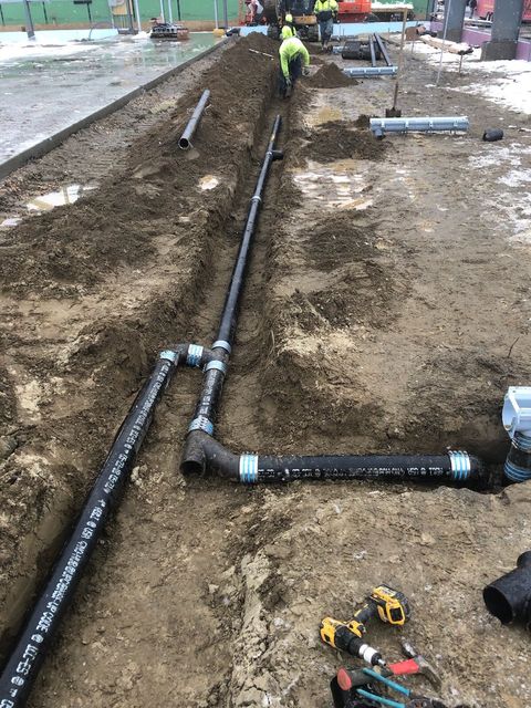 Plumbing Repairs — Plumber Fixing Faucet With Red Gloves in Lee, MA Plumbing Repairs — Plumber Fixing Faucet With Red Gloves in Lee, MA