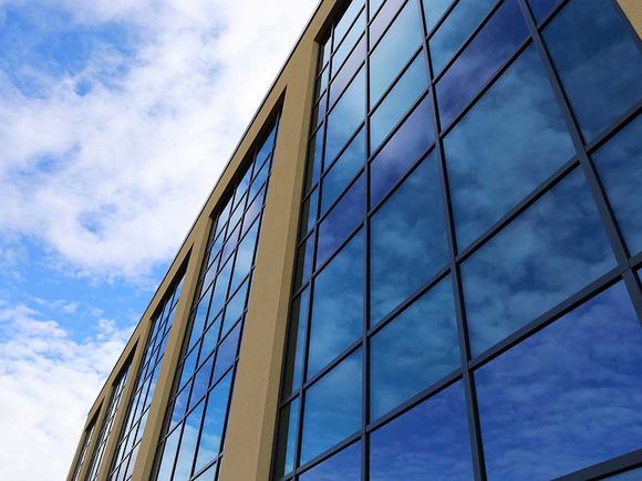 Commercial Building With Many Tinted Windows — Greenville, SC — iTint Commercial Building With Many Tinted Windows — Greenville, SC — iTint