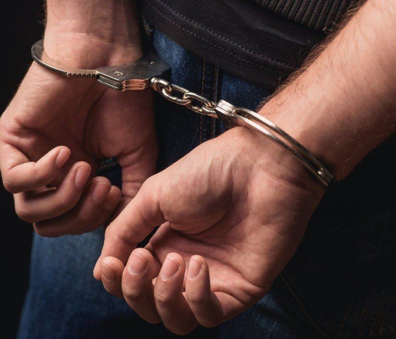 Hands in set of Handcuffs