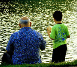 Grandfather & Grandson by Waterside