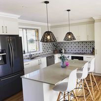 Modern White kitchen With Black Fridge — DMB Kitchens in Port Macquarie, NSW