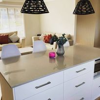 Grey Kitchen Bench With Flowers — DMB Kitchens in Port Macquarie, NSW