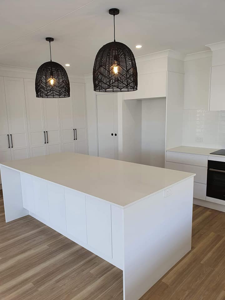 Large White Kitchen Island With Black Lights — DMB Kitchens in Port Macquarie, NSW