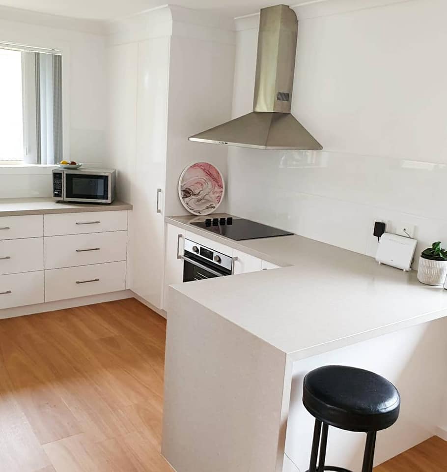 White Kitchen With Stove Top — DMB Kitchens in Port Macquarie, NSW