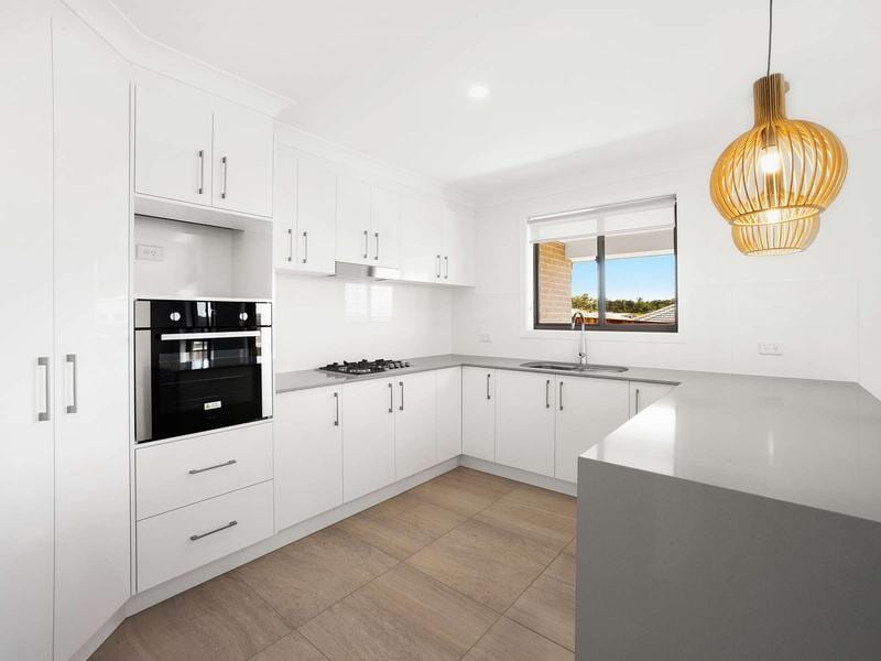 Luxury home interior Beautiful kitchen with custom white shaker cabinets — DMB Kitchens in Port Macquarie, NSW