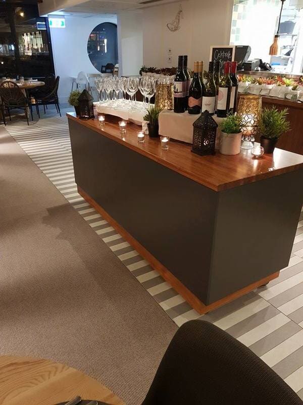 Luxury Beautiful kitchen with centre brown table — DMB Kitchens in Port Macquarie, NSW