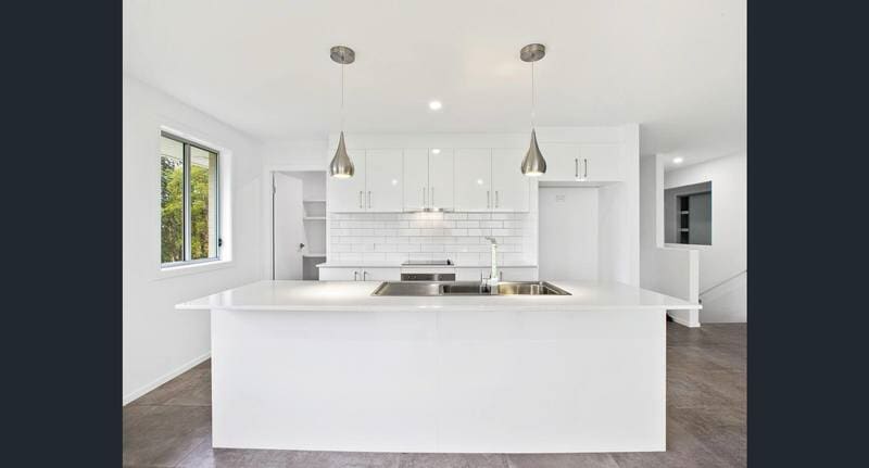 Elegant white table and cabinets — DMB Kitchens in Port Macquarie, NSW