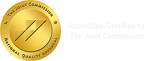 The Joint Commission accredited seal in gold with faint “Accredited/Certified by The Joint Commission” text