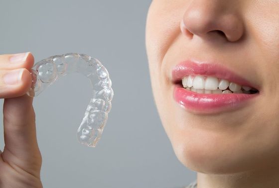 Smiling woman with brace