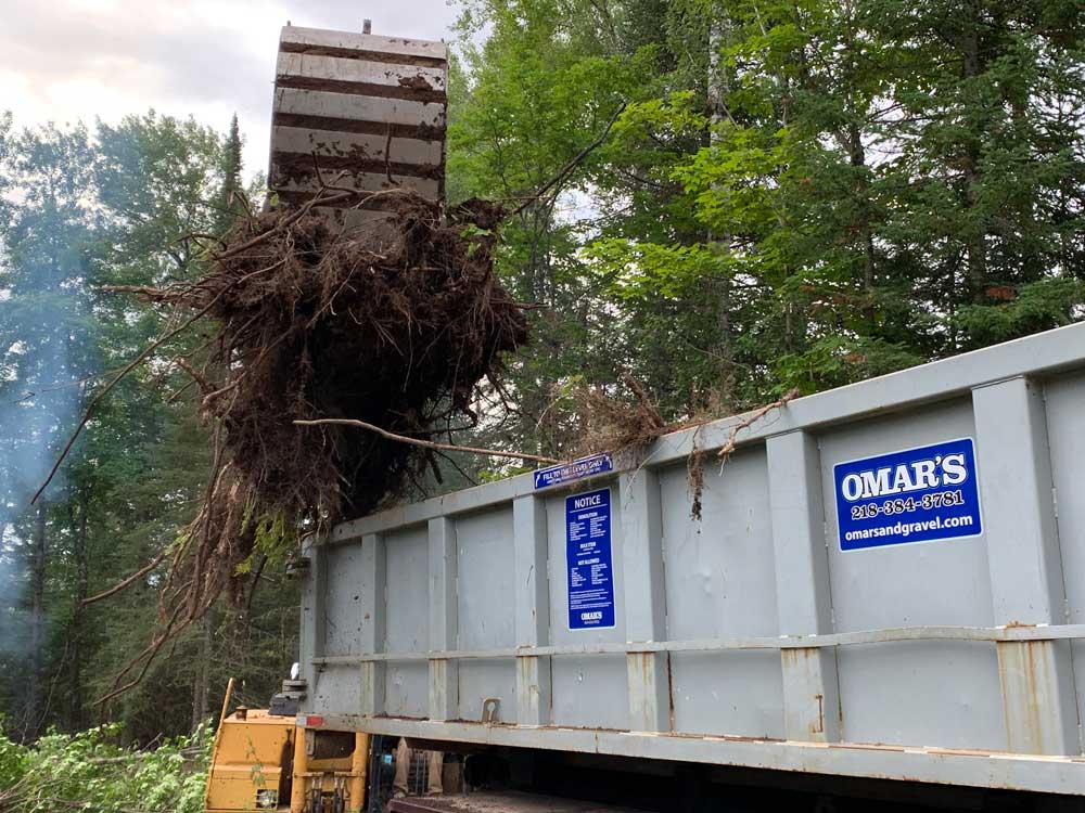 Stump Removal — Carlton, MN — Omar's Sand & Gravel Stump Removal — Carlton, MN — Omar's Sand & Gravel