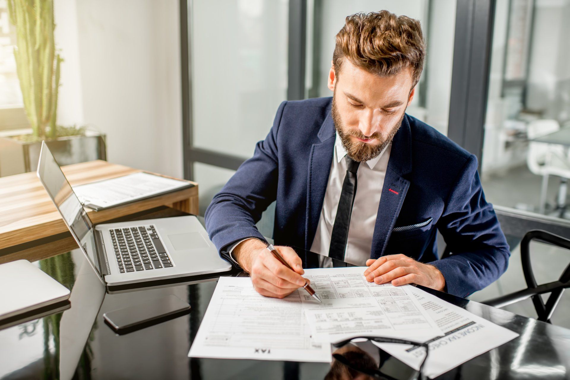 Tax Services — Businessman Working on Tax Papers in Gulfport, MS Tax Services — Businessman Working on Tax Papers in Gulfport, MS