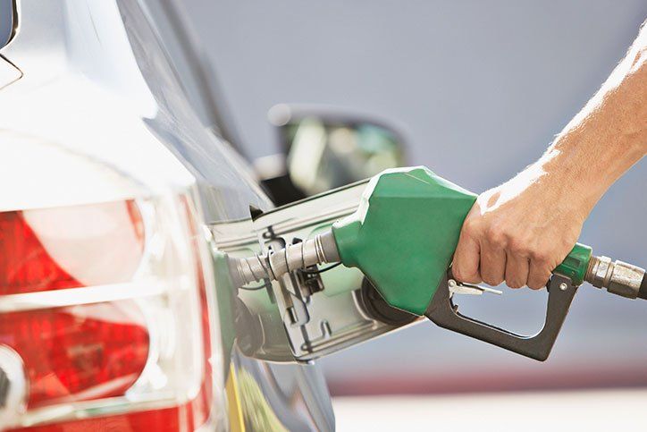 Man Pumping Gas — Oklahoma City, OK — Penley Oil Company Man Pumping Gas — Oklahoma City, OK — Penley Oil Company