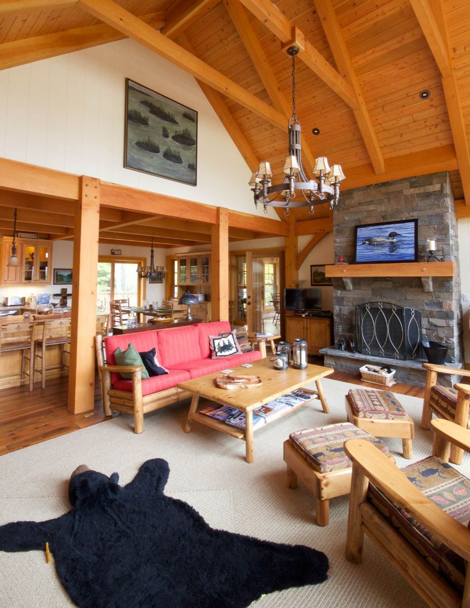 Custom Muskoka Cottage featuring a living room with a bear rug on the floor