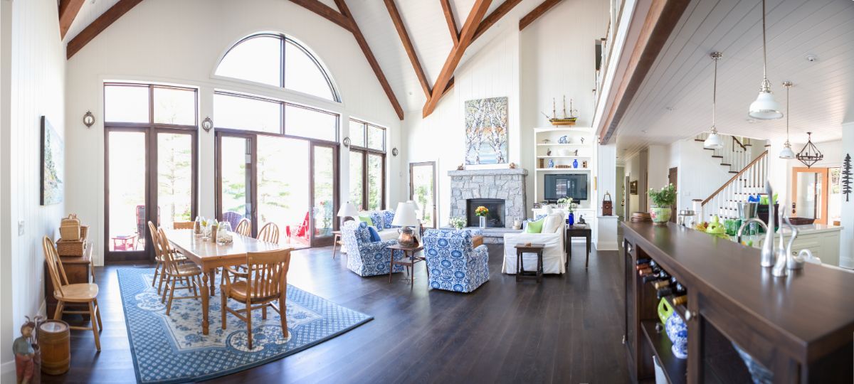 Custom Muskoka Cottage featuring a
large living room filled with furniture and a fireplace.