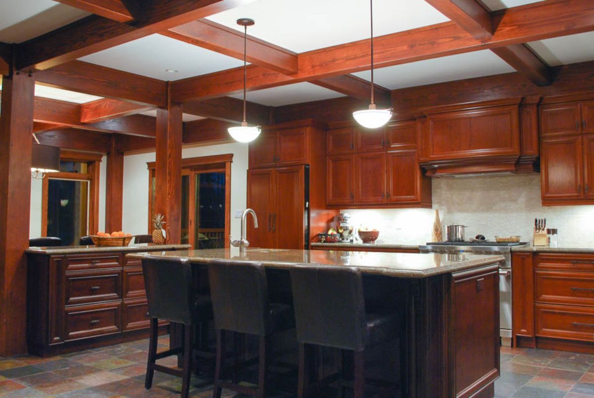 Custom Muskoka Cottage featuring a kitchen with wooden cabinets and a large island