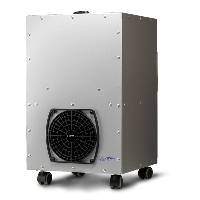 Silver air purifier on wheels, black fan grill.