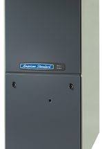 American Standard furnace with dark gray panels and blue logo.