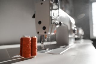White Sewing Machine and Red Threads | Belgrade, MT | The Stitch House White Sewing Machine and Red Threads | Belgrade, MT | The Stitch House