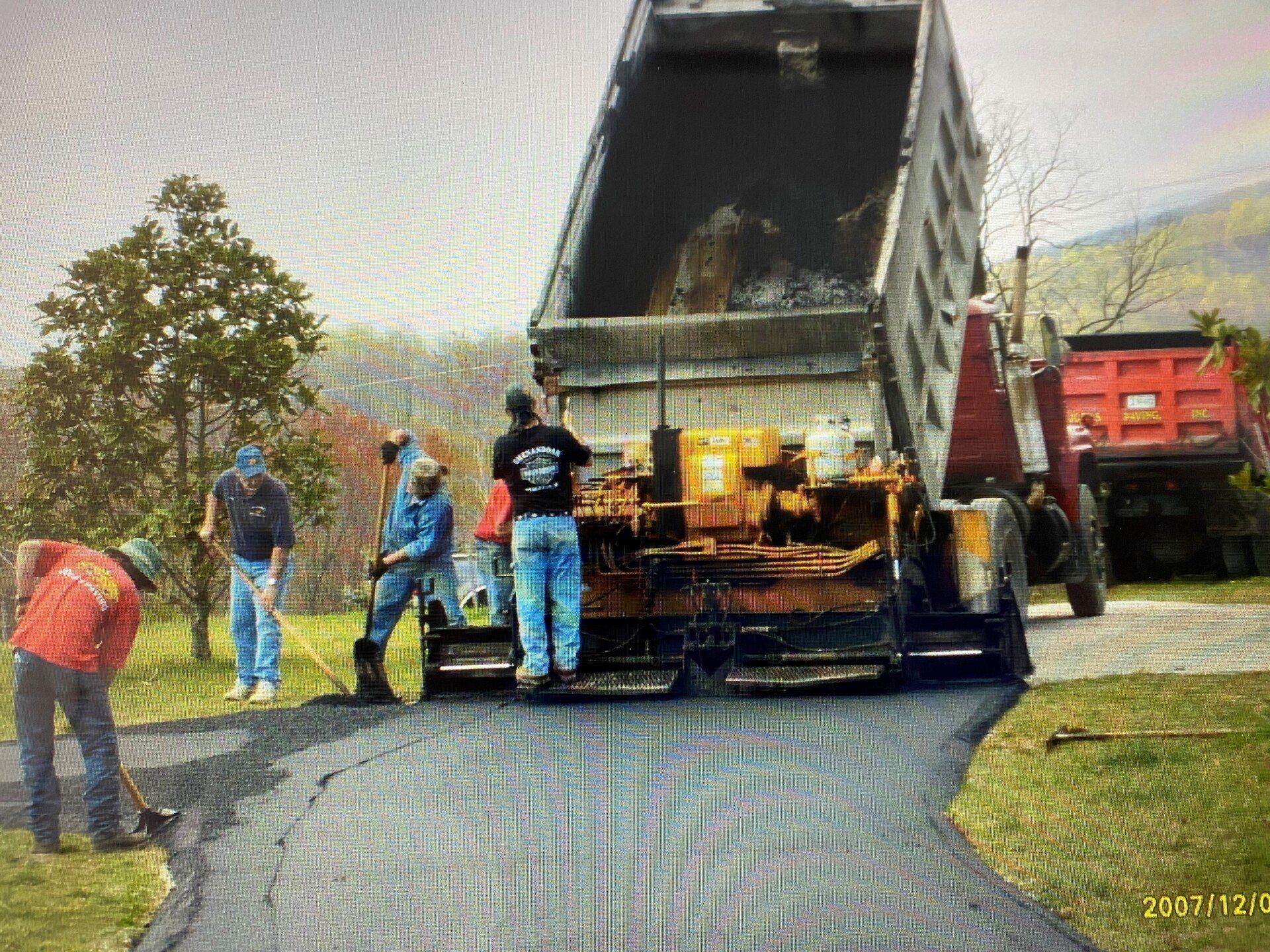 Worker Regulate Tracked Paver — Waynesboro, VA — Josh's Paving Inc.