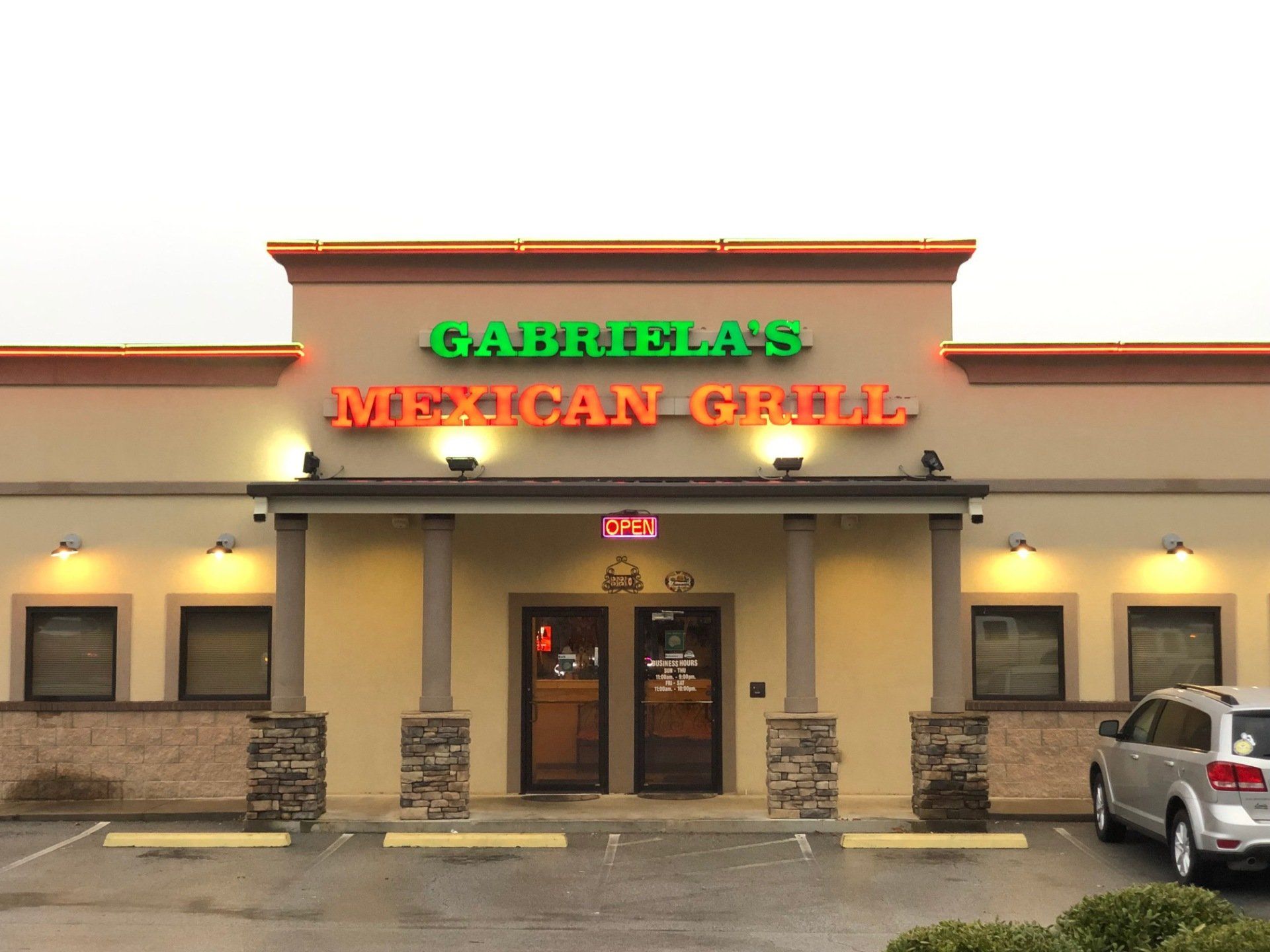 A car is parked in front of gabriel 's mexican grill