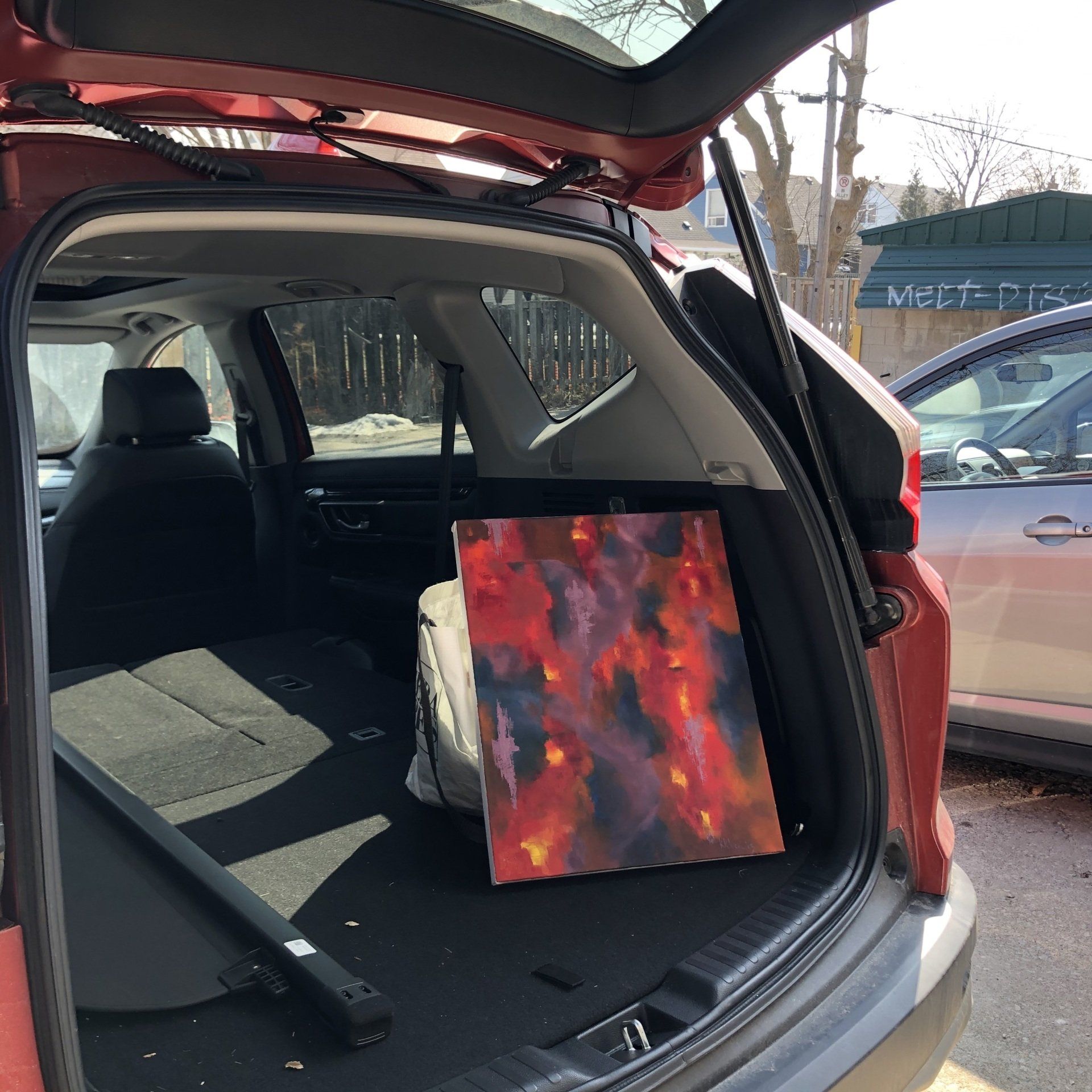 Photo of art in car for delivery.