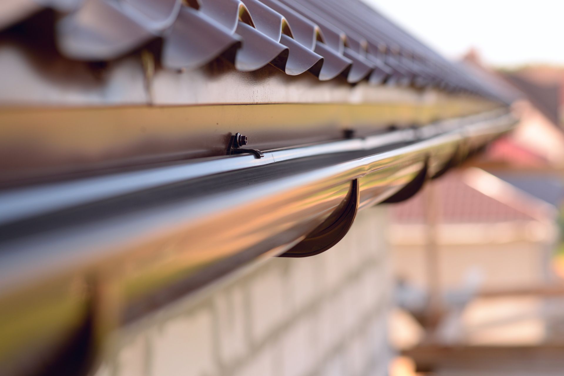 View of installed metal roof with gutters