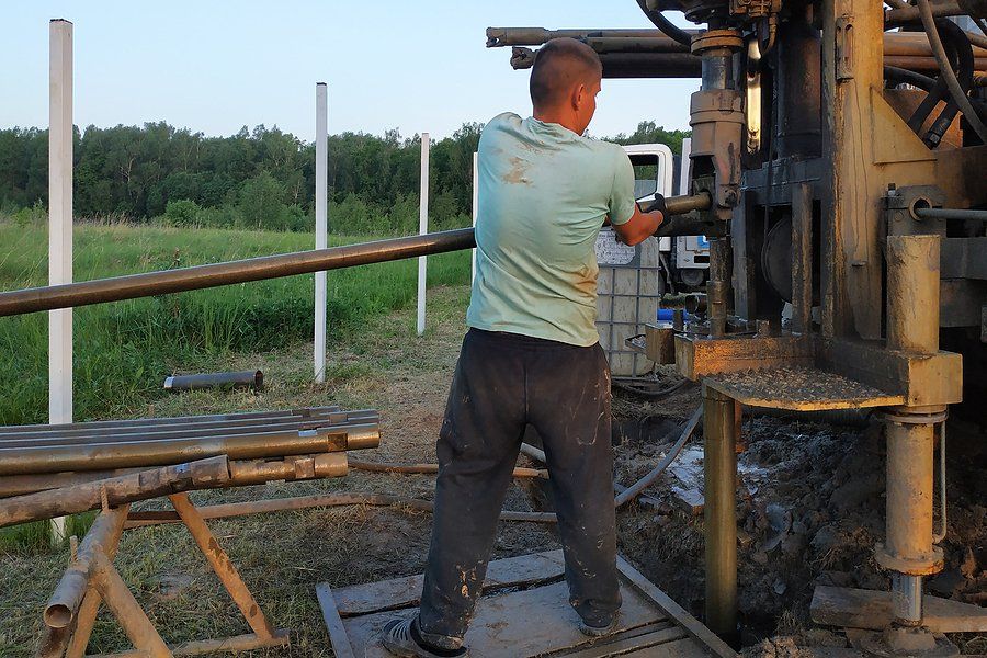 man fixing the pump system