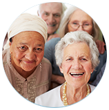 A group of elderly people are smiling for the camera.